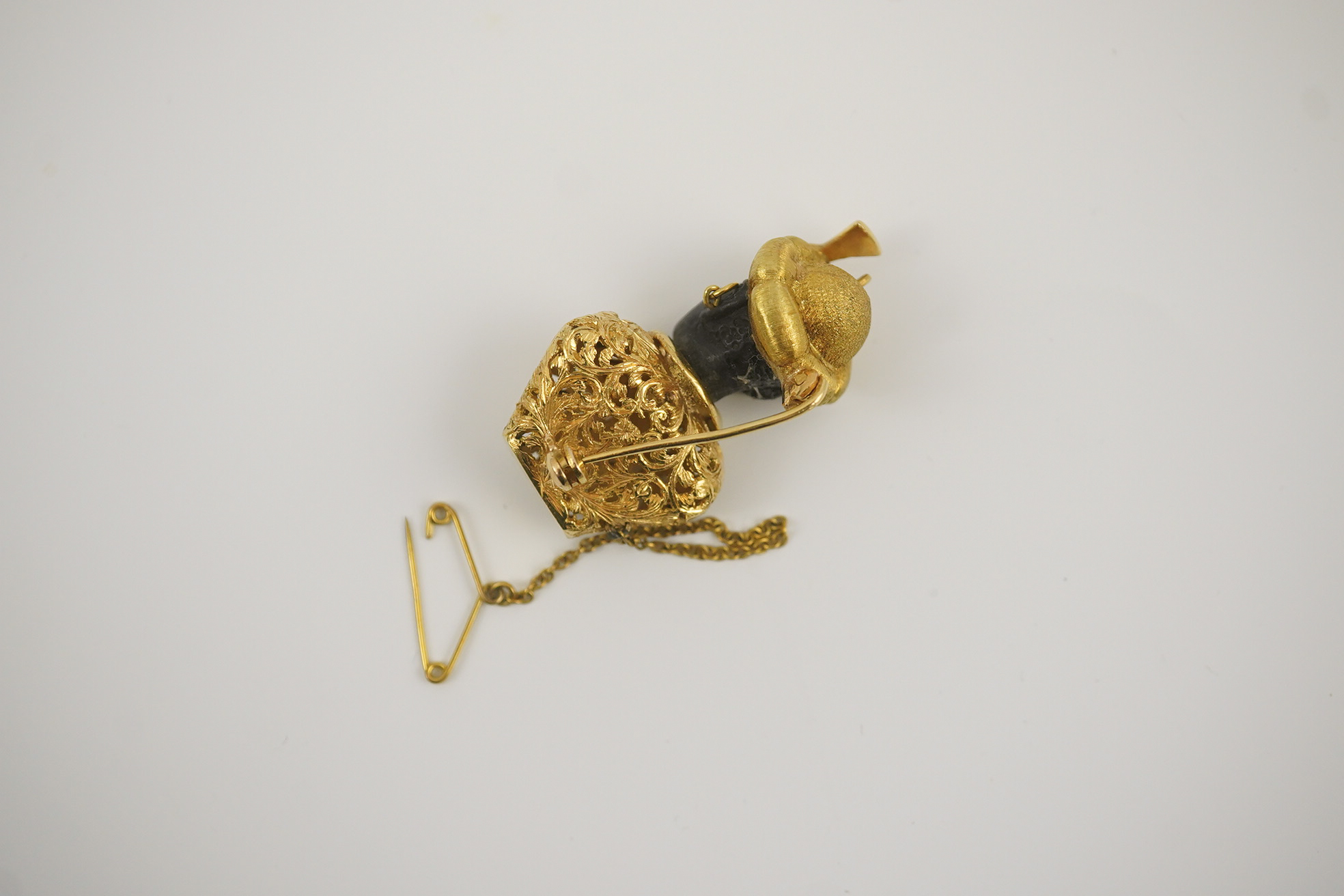 A gem-set charm bracelet and brooch, Italy, 20th century